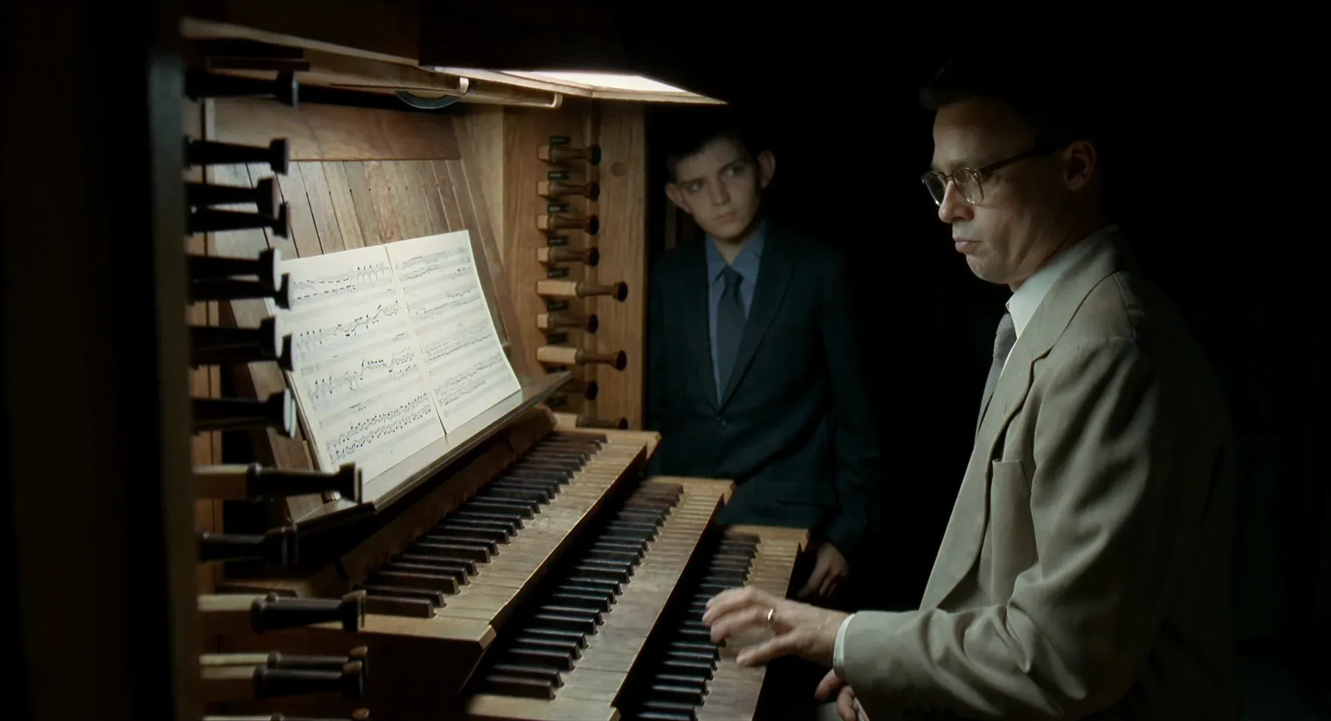 Mr. O’Brien (Brad Pitt) and young Jack (Hunter McCracken) at the organ